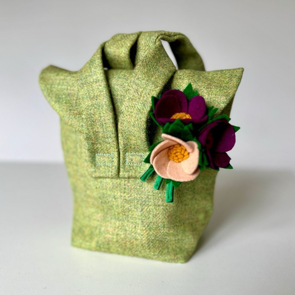 William and Tilda 1940s style gas mask bag made out of green tweed